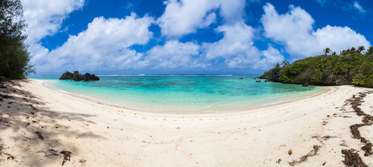 Fototapeta na wymiar Toataratara Point. View of yellow white sandy tropical beach in a secluded bay. Rurutu island, Austral islands (Tubuai islands), French Polynesia, Oceania, South Pacific Ocean. Tahiti and her islands