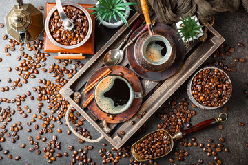 Black coffee in a composition with kitchen accessories