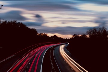 motor way freeway head and tail lights trailing along in red and white