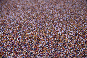 Horizontal texture of multicolored small stones top view