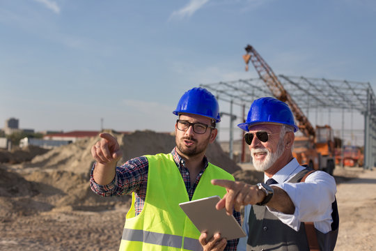 Engineers Talking At Building Site