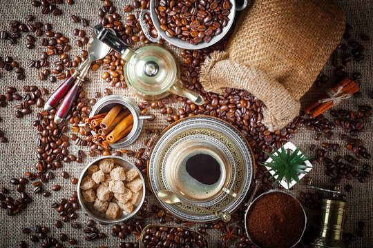 Black coffee in a cup on old background © Karnav