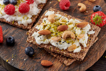 Sandwich with nuts and berrie Useful breakfast.