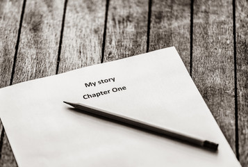 Pencil and paper for writer. Photo in retro color style.