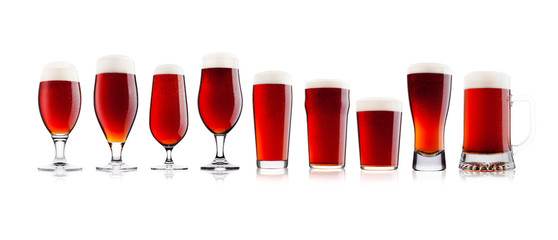 Cold glasses of red bitter ale beer with foam