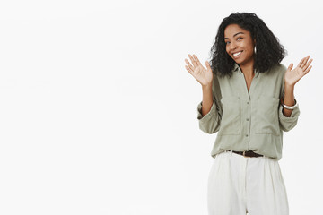 Guys I am out of this. Portrait of uninvolved charismatic young dark-skinned employer in blouse...