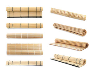 Set with bamboo mats on white background