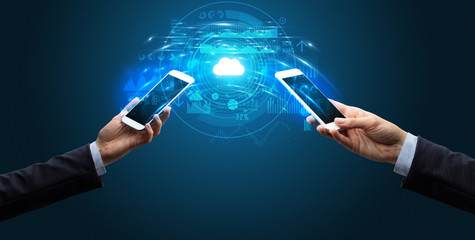 Two mobile phones syncing through the cloud