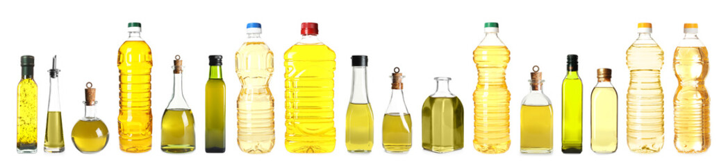 Set with different bottles of oil on white background