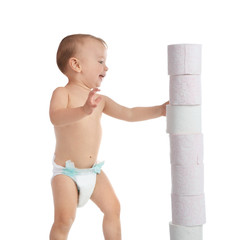 Cute toddler and toilet paper tower on white background