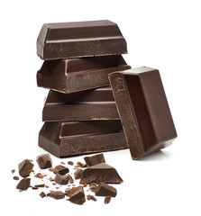Broken dark chocolate bars, chips or pieces isolated on white background