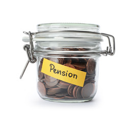Coins in glass jar with label 