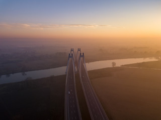 foggy bridge on the Vistula at sunset, Krakow, Poland