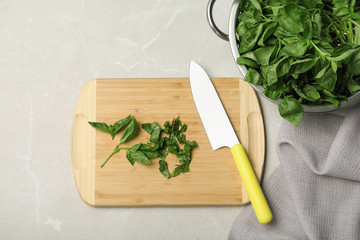 Flat lay composition with basil leaves on grey background