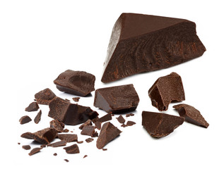 Broken chocolate pieces, morsels or cracked chocolate parts isolated on white background