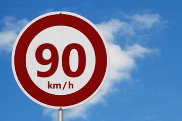 Red and white 90 km speed limit sign