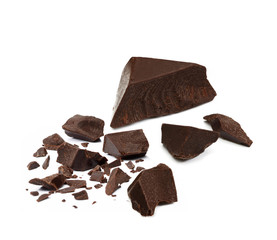 Broken, cracked or crushed dark chocolate parts from top view isolated on white background