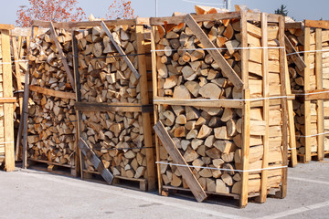 chopped firewood stacked in boxes for sale
