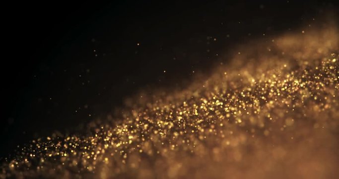 Gold Background movement. Particle gold dust shining on black background. Motion abstract flickers.Elegent Movement.