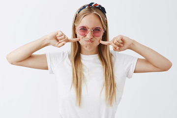 Girl want to be silly and have fun today. Attractive rebellious and fashionable caucasian woman in...