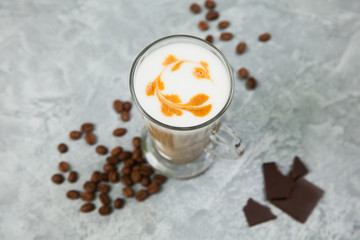 Obraz na płótnie Canvas Latte coffee arabica espresso beans dark chocolate background.
