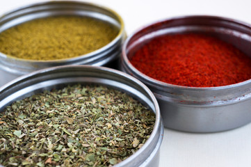 Spices in bowls. Paprika, curry, oregano