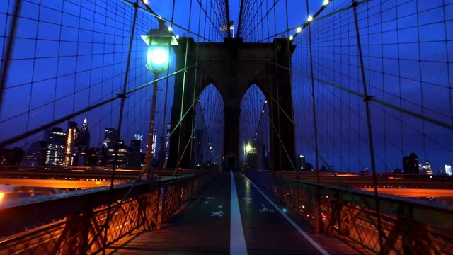 Walking in Brooklyn bridge at night