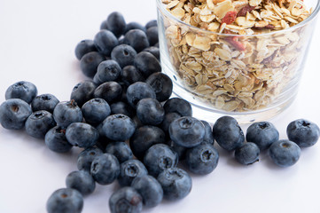 Blueberry, or heath berry, and muesli (whole grain dry breakfast) in a glass