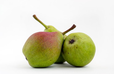 Fresh green and red pears of white background
