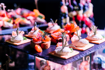 Tasty decorated cheese bar with snacks for wedding Banquet. An unusual reception for the newlyweds and guests