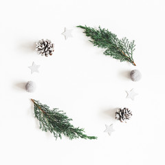 Fototapeta na wymiar Christmas composition. Wreath made of fir tree branches, decorations on white background. Christmas, winter, new year concept. Flat lay, top view, copy space, square