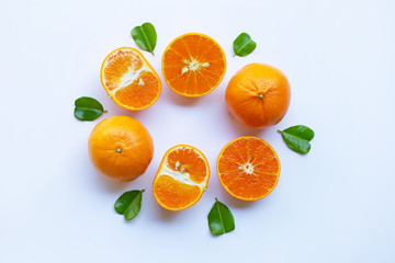 Fototapeta na wymiar Fresh oranges with half of Bergamot kaffir lime leaves, heart shape on white background