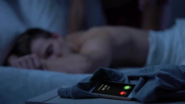 Ex calling, lady coming and kissing sleepy male on background, new passion