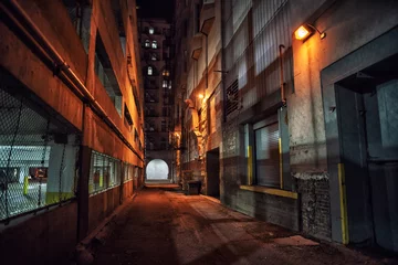 Aluminium Prints Narrow Alley Dark and eerie downtown urban city alley with a loading dock nex
