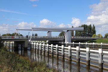 Steel drawbridge over river Hollandsche IJssel between Gouda and Gouderak named Gouderaksebrug
