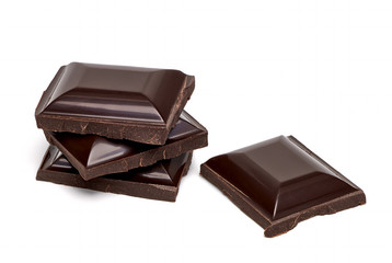 Broken or cracked dark chocolate bars or tablets isolated on white background