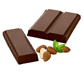 Broken chocolate blocks and parts with almonds isolated on white background