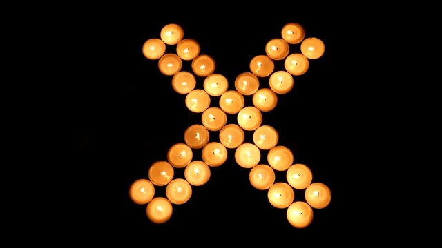 X-shape made from candle light.