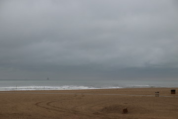 Dark clouds above the North Sea at the Beach of Scheveningen in the Netherlands