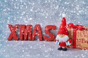Christmas background with Santa Claus and gifts. Copy space, snow texture