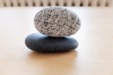 Fototapeta na wymiar stones on a wooden background