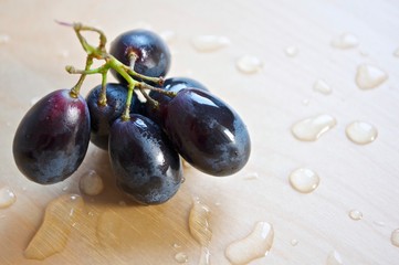 fresh grapes on a wooden background