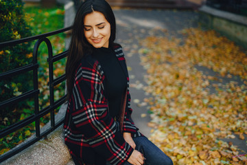 stylish girl walking through the city