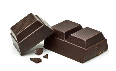 Broken or cracked Dark Chocolate Bar or tablets with vanilla beans isolated on white background