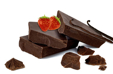 Broken or cracked dark chocolate bars, chips or pieces with vanilla and strawberries isolated on white background