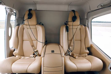 Selbstklebende Fototapete Hubschrauber Helicopter passenger leather seats. Interior of luxury helicopter 