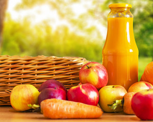 Fresh juice on nature background
