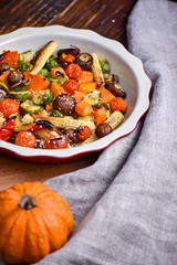 Grilled vegetables. Lenten menu. Appetizing eggplant, pepper, beetroot, tomato and patisson on plate. Fork, knife, napkin.Copy space