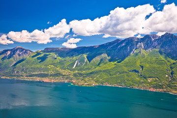 Naklejka na ściany i meble Lago di Garda and high mountain cliffs above Malcesine view
