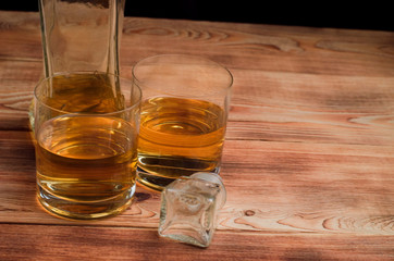 Glasses for whiskey on a wooden table